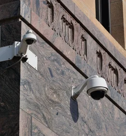 Modern surveillance cameras mounted on a building
