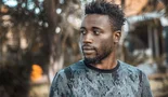 Man photographed outdoors in Kampala