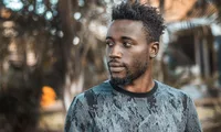Man photographed outdoors in Kampala