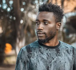 Man photographed outdoors in Kampala