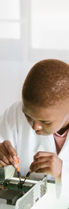 Black technician repairing computer hardware