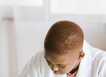 Black technician repairing computer hardware