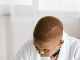 Black technician repairing computer hardware