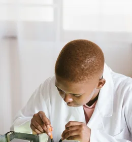Black technician repairing computer hardware