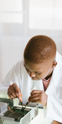 Black technician repairing computer hardware