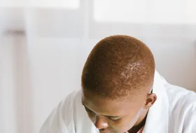 Black technician repairing computer hardware