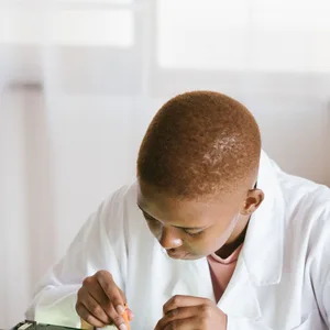 Black technician repairing computer hardware