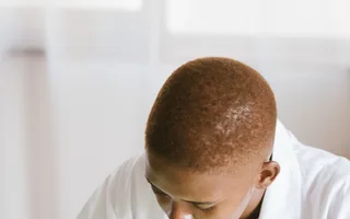 Black technician repairing computer hardware