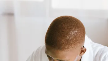 Black technician repairing computer hardware