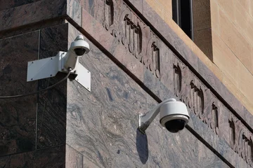Modern surveillance cameras mounted on a building