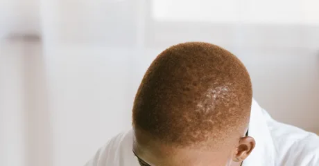 Black technician repairing computer hardware