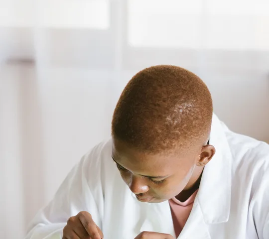 Black technician repairing computer hardware