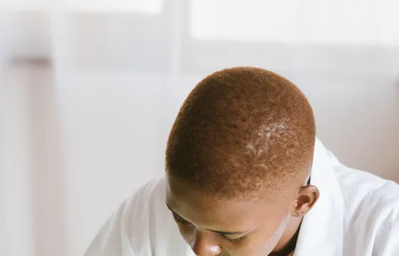 Black technician repairing computer hardware