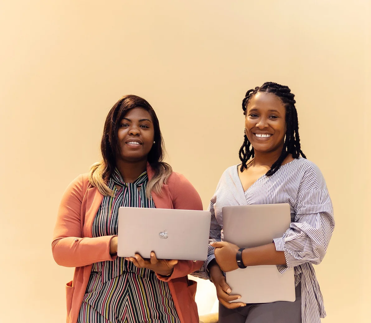 African businesswomen collaborating with laptops