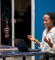 Woman using a laptop in Kampala
