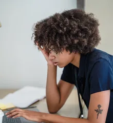Black businesswoman working on a laptop