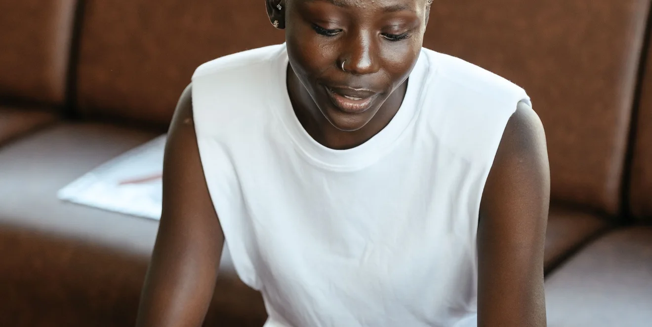 Black businesswoman reviewing documents at a desk