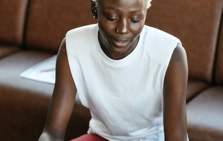 Black businesswoman reviewing documents at a desk