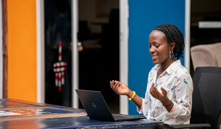 Woman using a laptop in Kampala