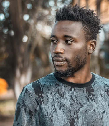 Man photographed outdoors in Kampala