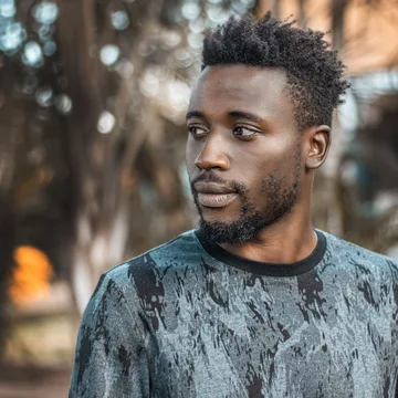 Man photographed outdoors in Kampala