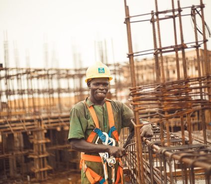 Construction worker wearing safety equipment in Kitgum
