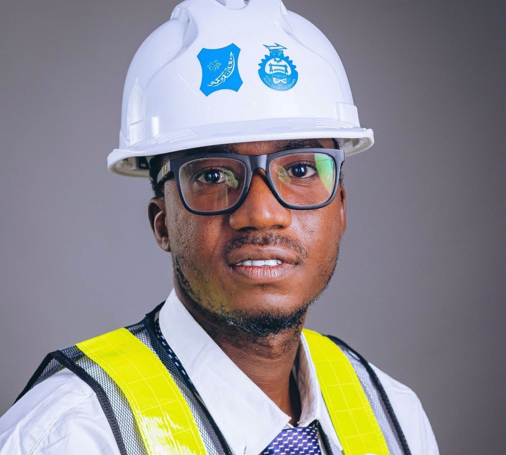 African engineer wearing a helmet and safety vest