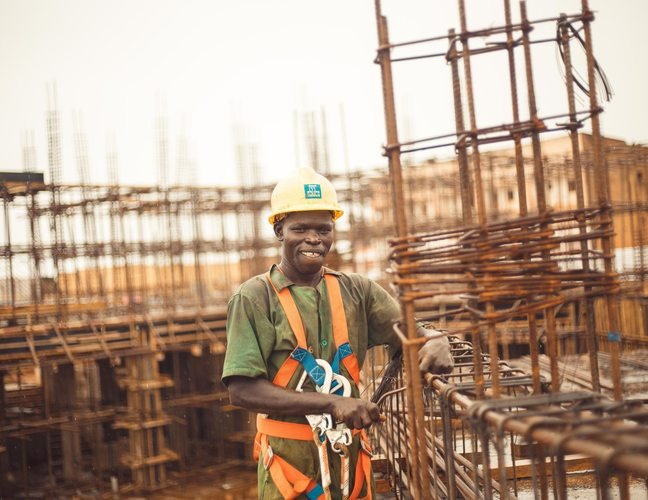 Construction worker wearing safety equipment in Kitgum