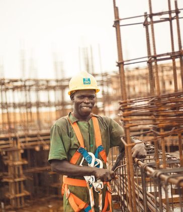 Construction worker wearing safety equipment in Kitgum
