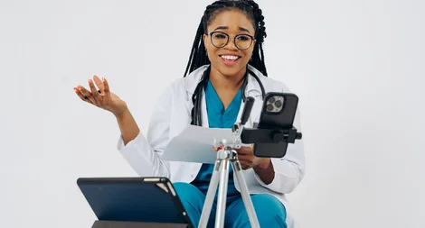 Black female doctor providing an online consultation