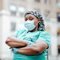 Black female doctor wearing a medical mask