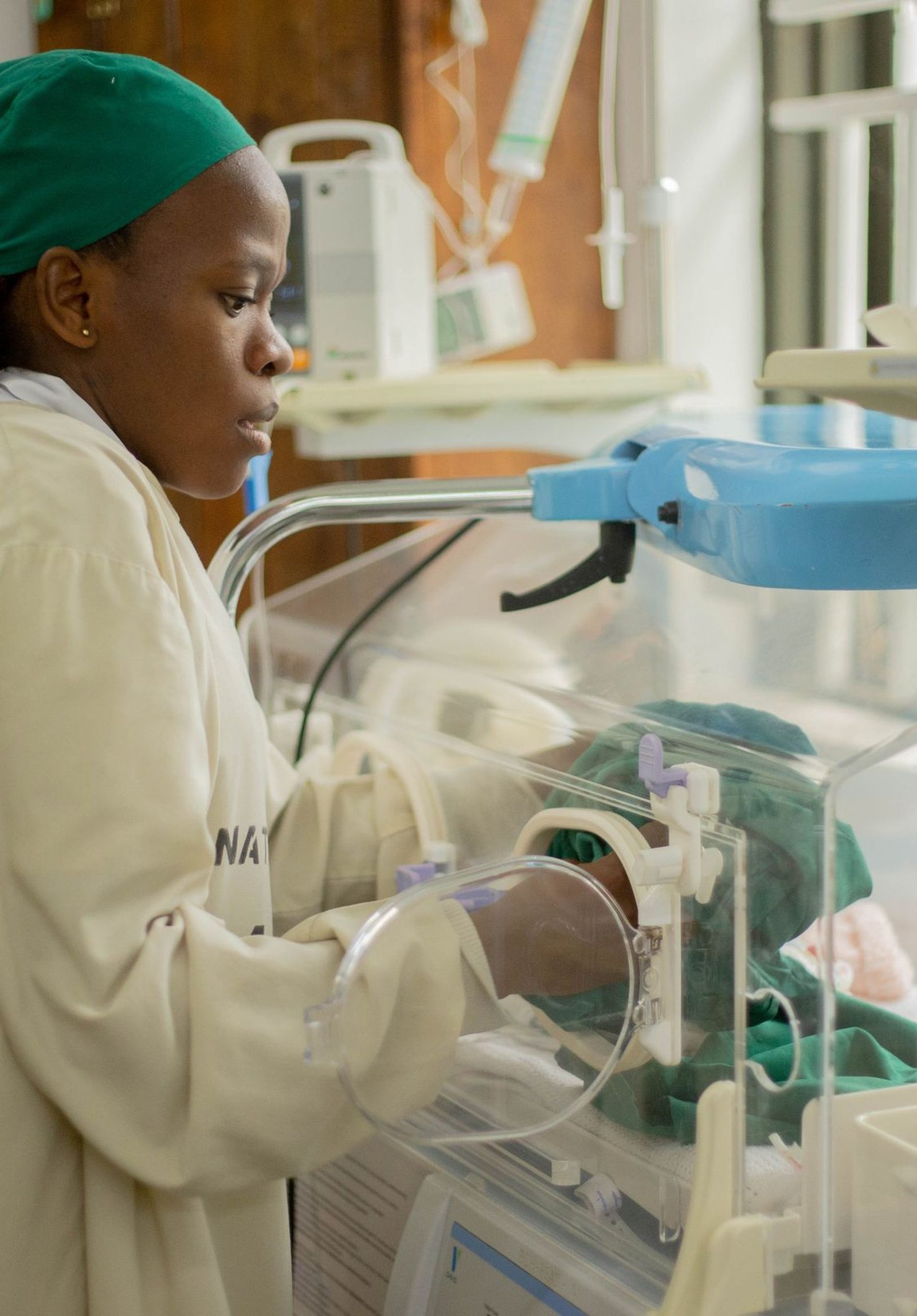 Nurse providing neonatal care in a hospital