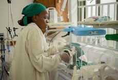 Nurse providing neonatal care in a hospital