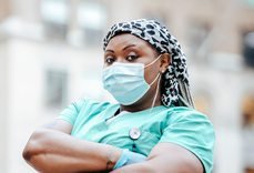 Black female doctor wearing a medical mask