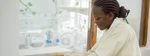 Nurse caring for a newborn in a hospital nursery