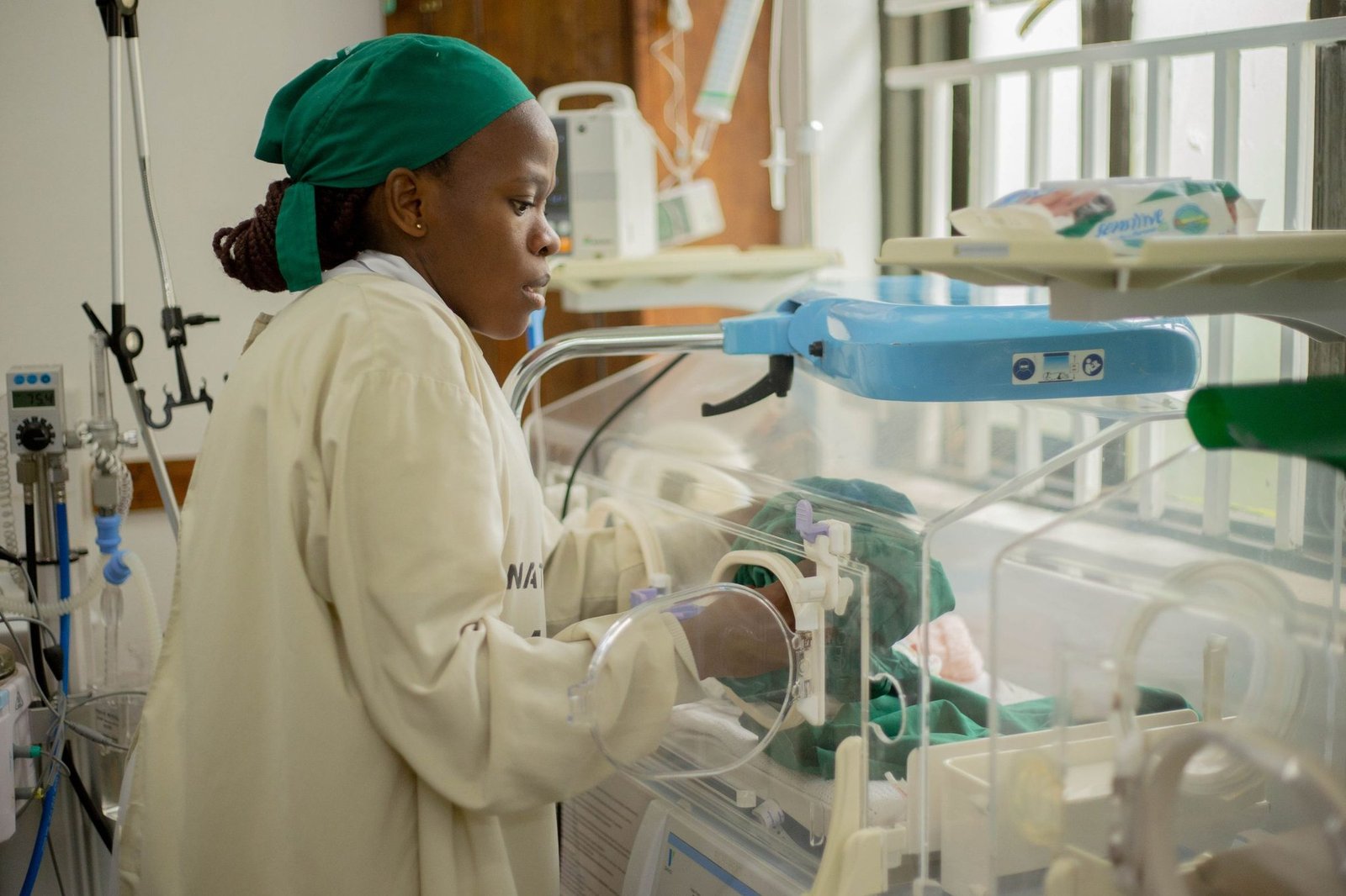 Nurse providing neonatal care in a hospital