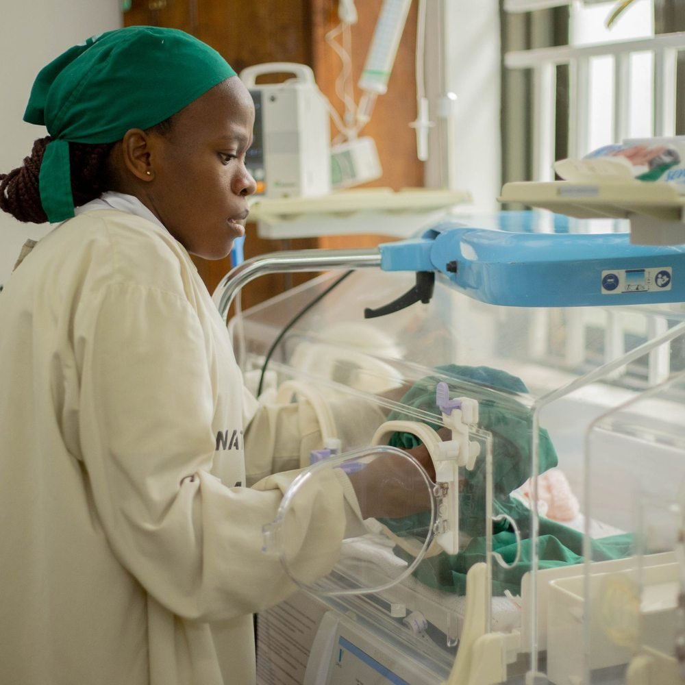 Nurse providing neonatal care in a hospital