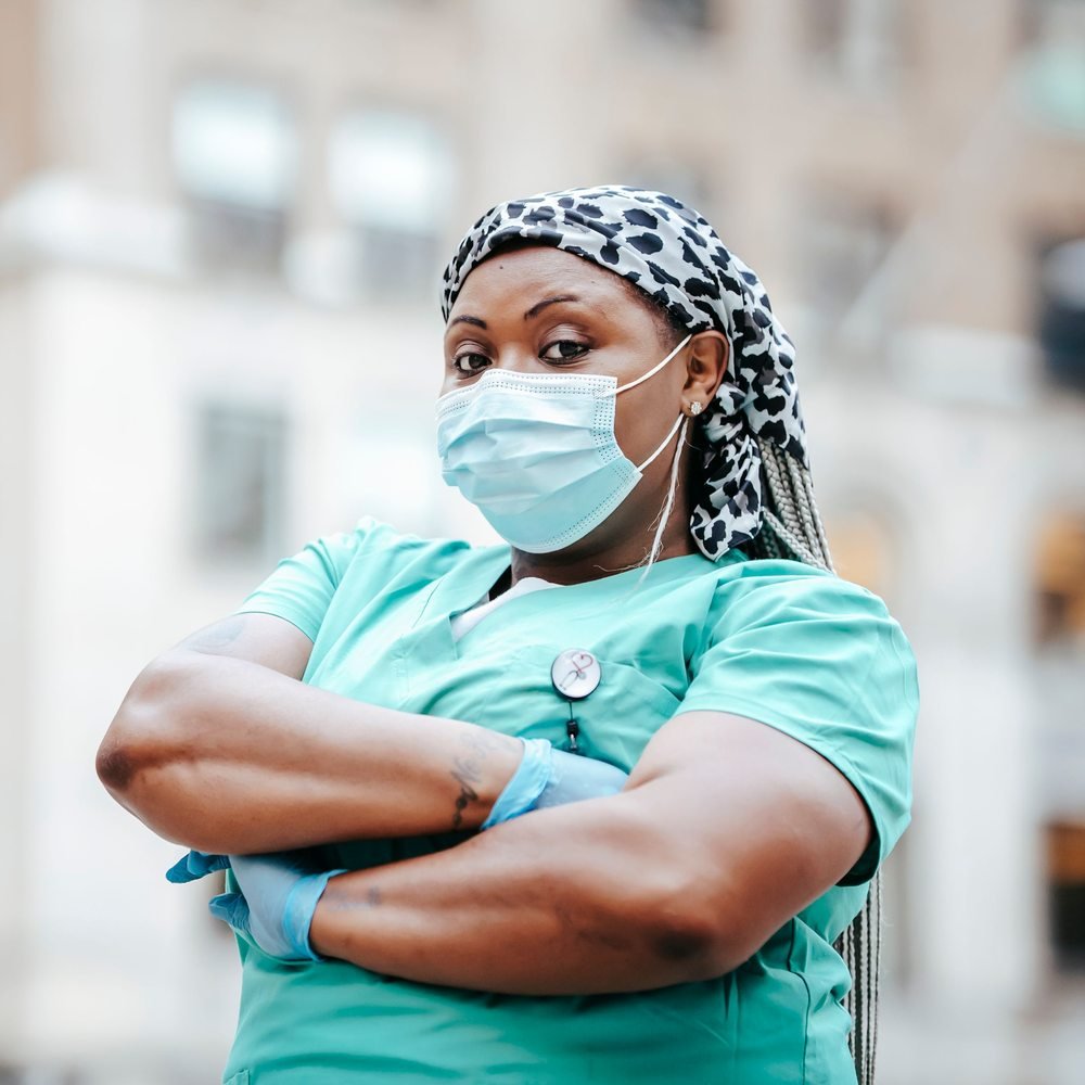 Black female doctor wearing a medical mask