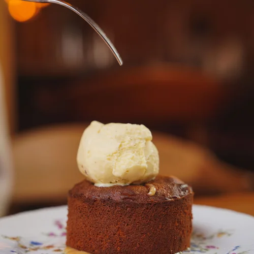 Cake served with a scoop of ice cream