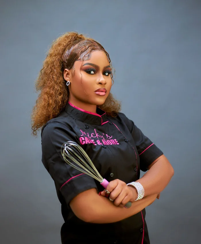Female chef holding a whisk
