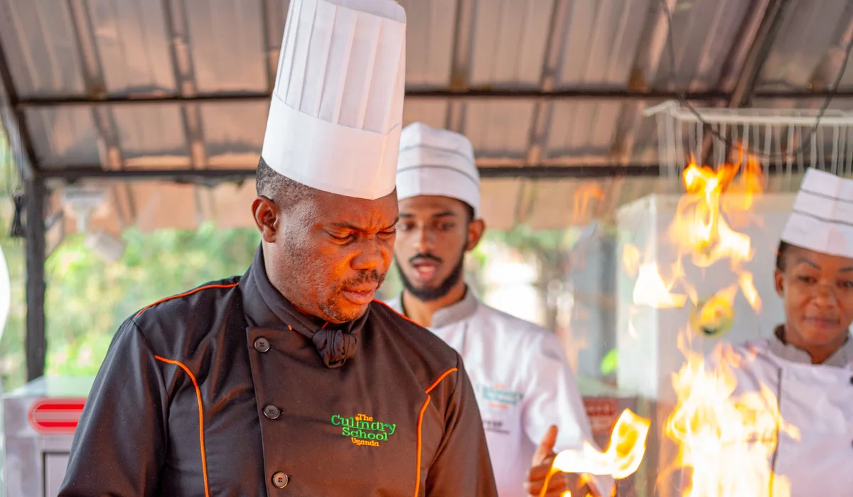 Chefs demonstrating cooking with fire in Uganda