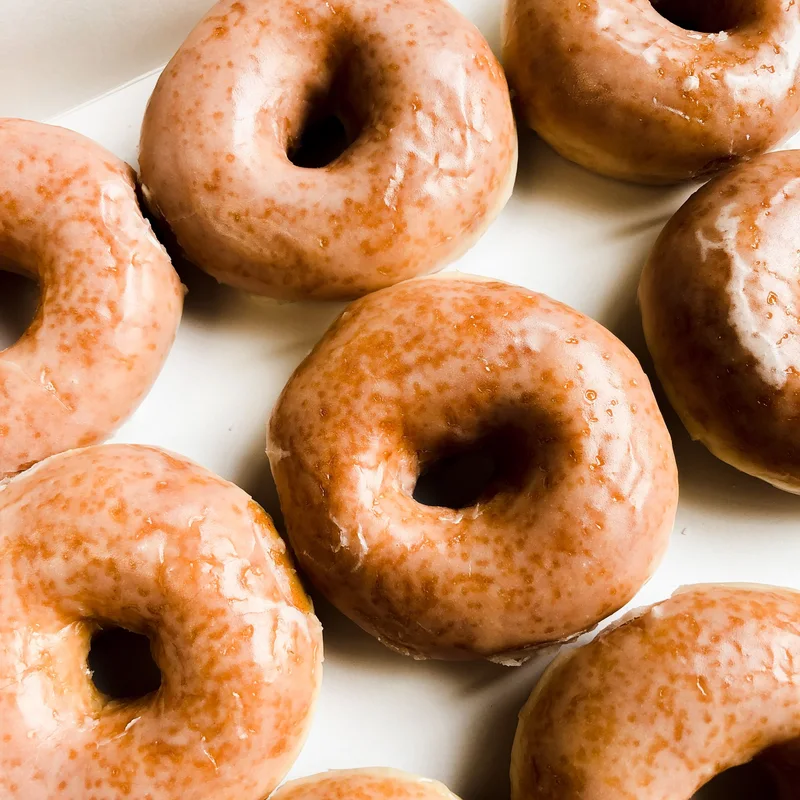 Fresh glazed donuts in a box