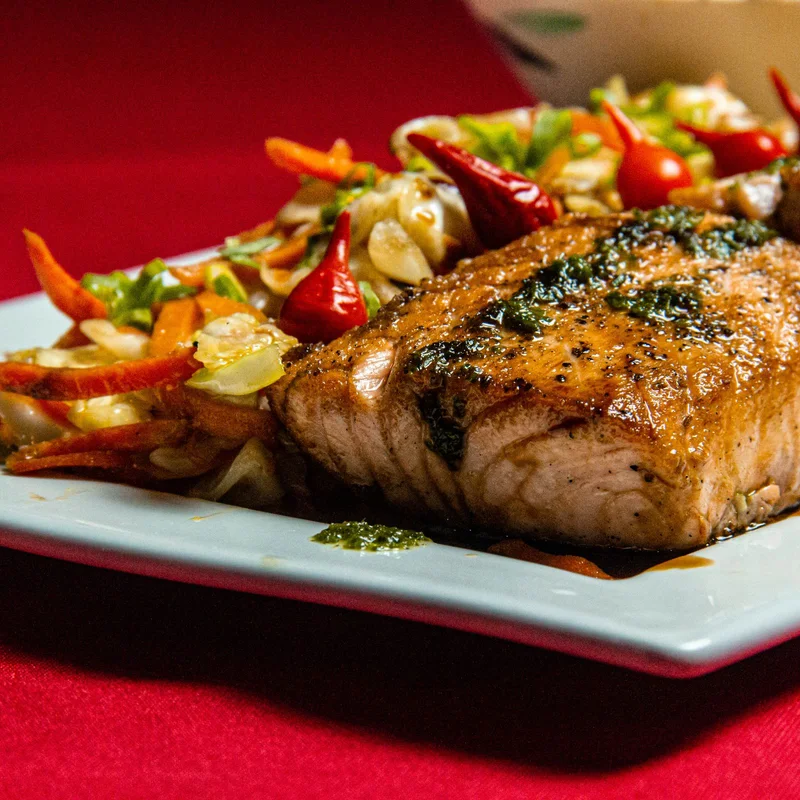 Grilled salmon served on a ceramic plate