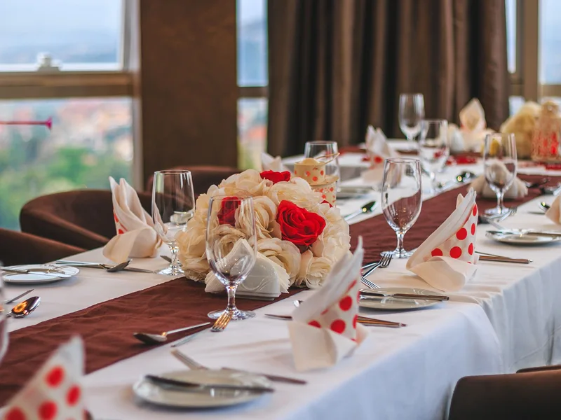 Dining tables set beside windows in Kampala