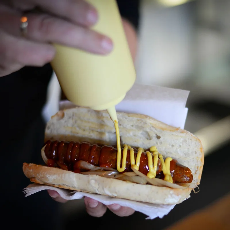 Hot dog with sausage and sauce
