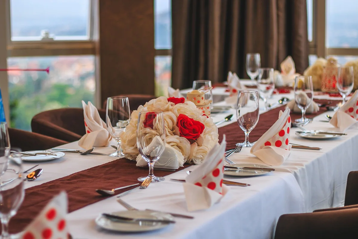 Dining tables set beside windows in Kampala