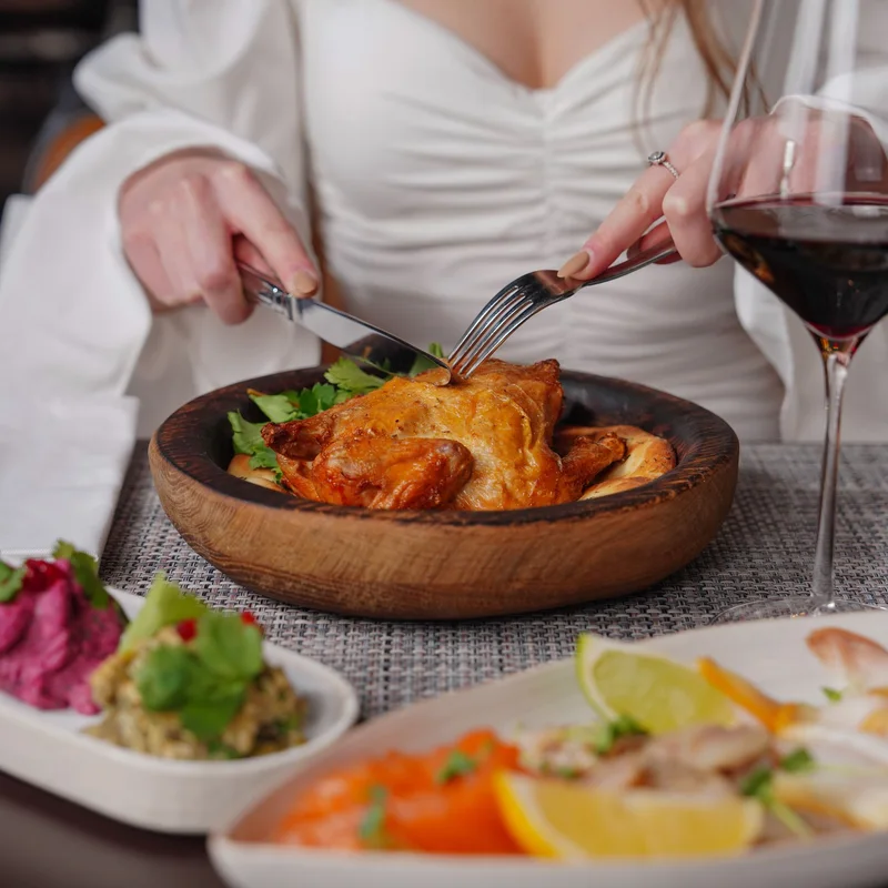 Roast chicken served at a dining table