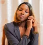 Woman in a blazer in an office setting