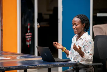 Woman using a laptop in Kampala