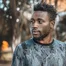 Man photographed outdoors in Kampala
